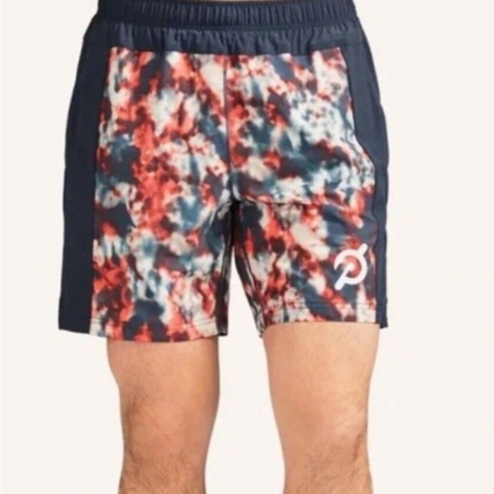 Peloton x Fourlaps 7" Bolt Lined athletic shorts in a red and grey tie-dye color